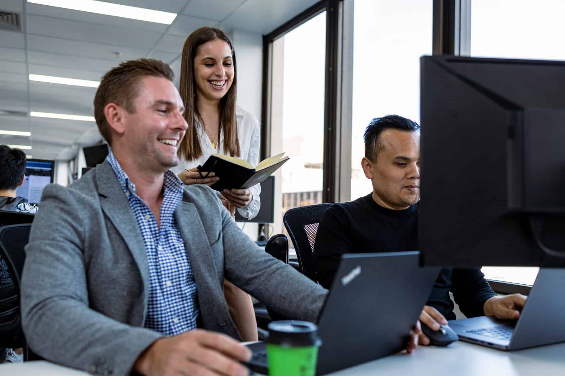 Staff augmentation team working in the office